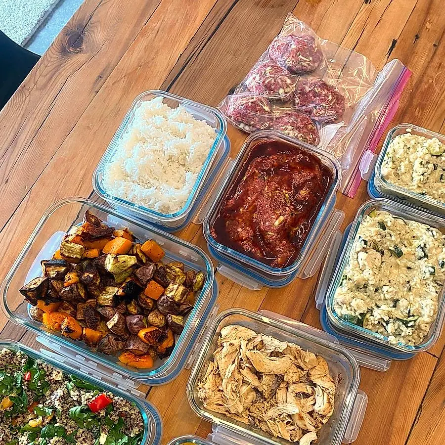 Roast vegetables, meats and rice prepped in glass containers